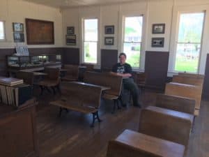 Old time class room filled with desks.