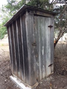 Wooden outhouse.