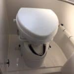 Composting toilet inside an RV bathroom.