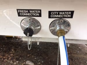 Fresh water and city water connection ports on the Oliver trailer.