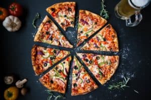 Photo by Fancycrave on Unsplash. Slices of veggie pizza.