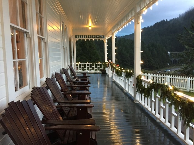 Adirondacks chairs on a porch.