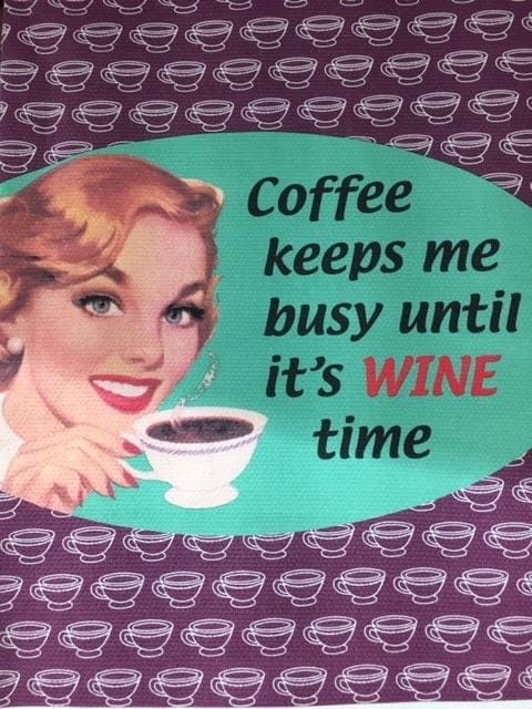 Old fashioned sign that reads, "Coffee keeps me busy until it's WINE time."