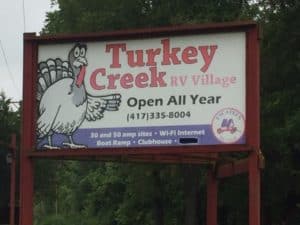 Road sign for Turkey Creek RV Park. 