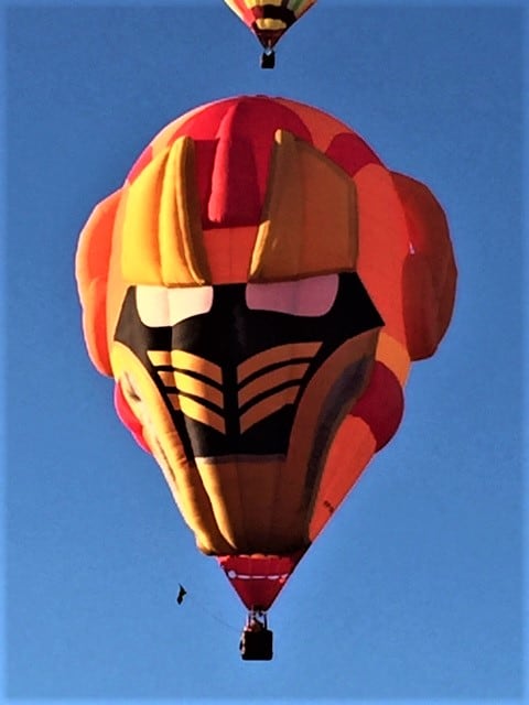 A red and yellow face hot air balloon.