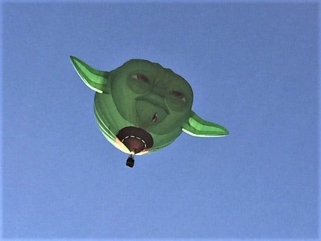Green hot air balloon with ears. In the shape of Star Wars' Yoda.