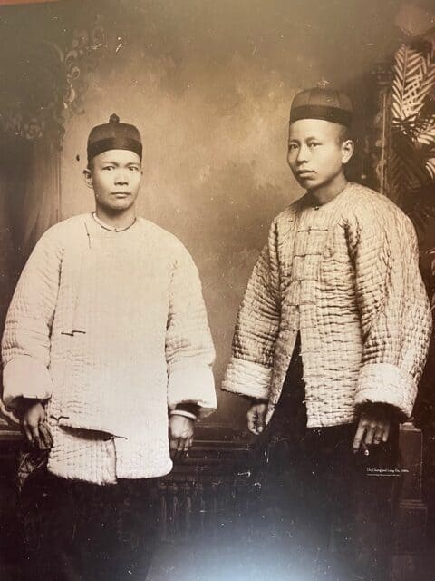 PHotograph of two Chinese men in traditional garb.