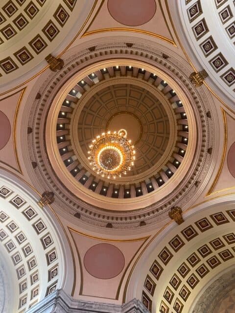 From directly below looking up, a photo of a huge chandelier.